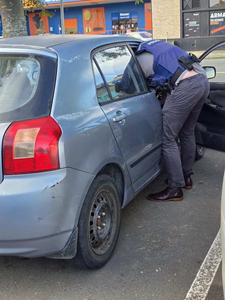 Police search car in Pukekohe carpark after aggravated robbery